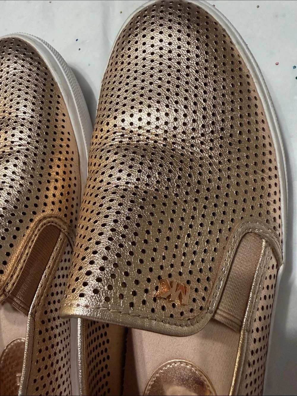 Michael Kors Metallic Rose Gold Perforated Slip-On Sneakers